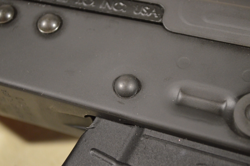 This bottom rivet should be dimpled into the receiver/trunnion. The receiver should look 